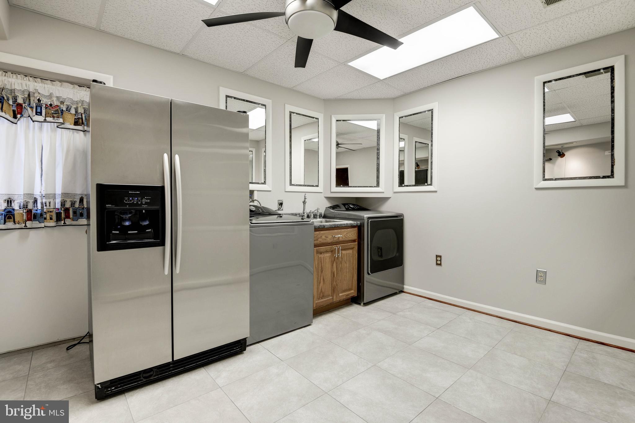 11805 Blue Spruce Road Reston, VA 20191 - Photo 61 of 74 a kitchen with stainless steel appliances a refrigerator sink and stove