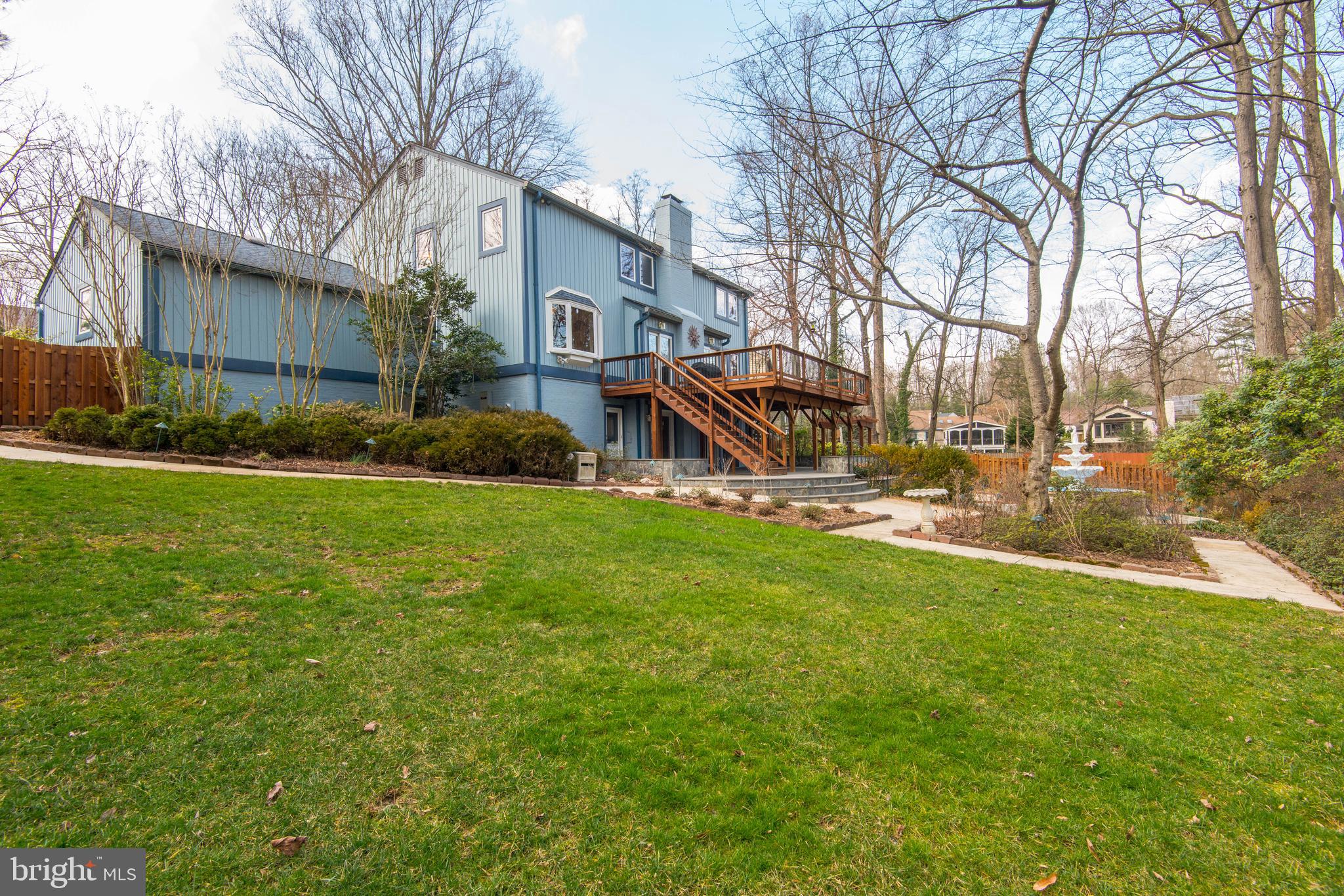 11805 Blue Spruce Road Reston, VA 20191 - Photo 66 of 74 a view of a house with backyard and a tree