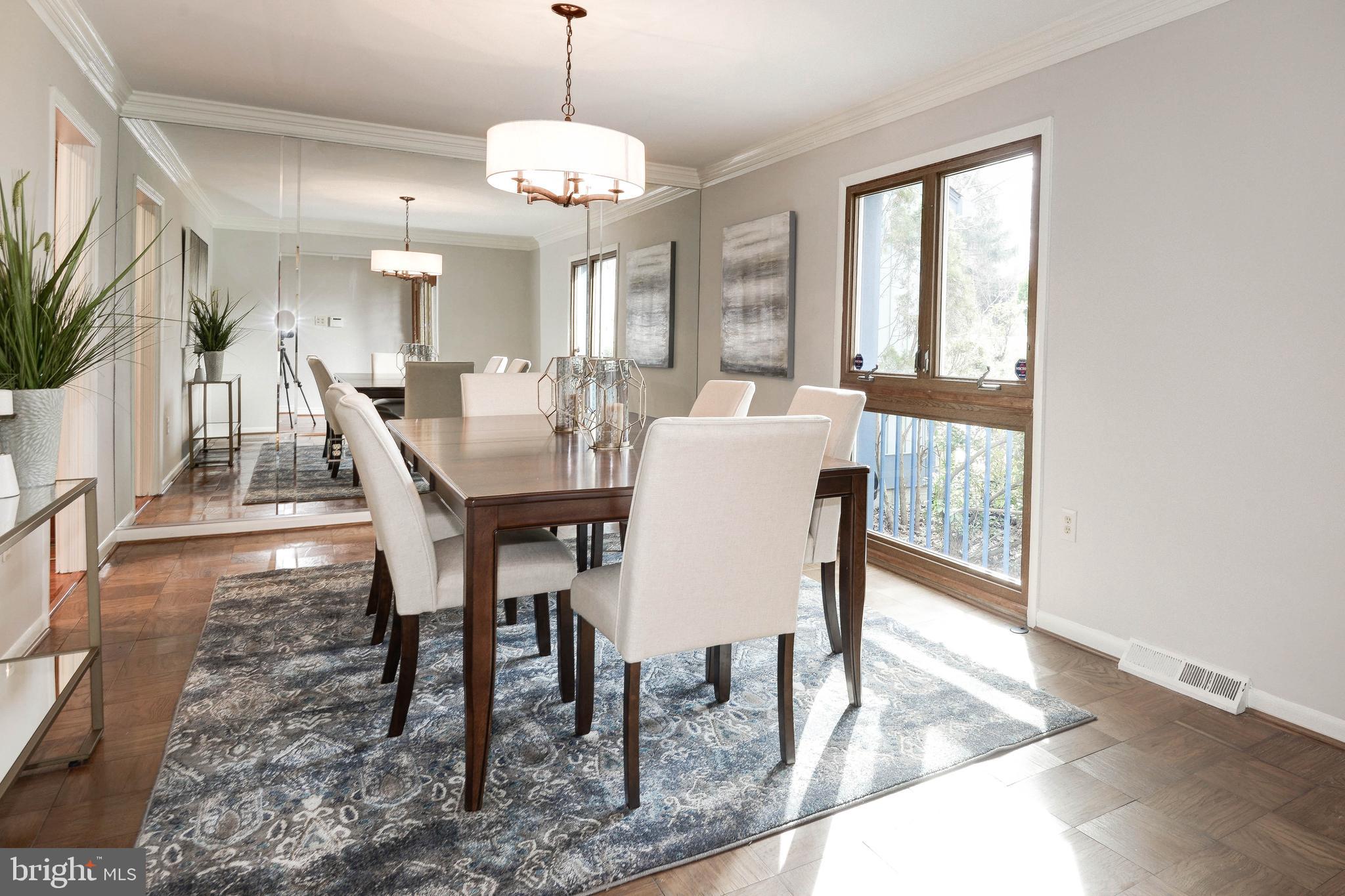 11805 Blue Spruce Road Reston, VA 20191 - Photo 8 of 74 a view of a dining room with furniture window and wooden floor