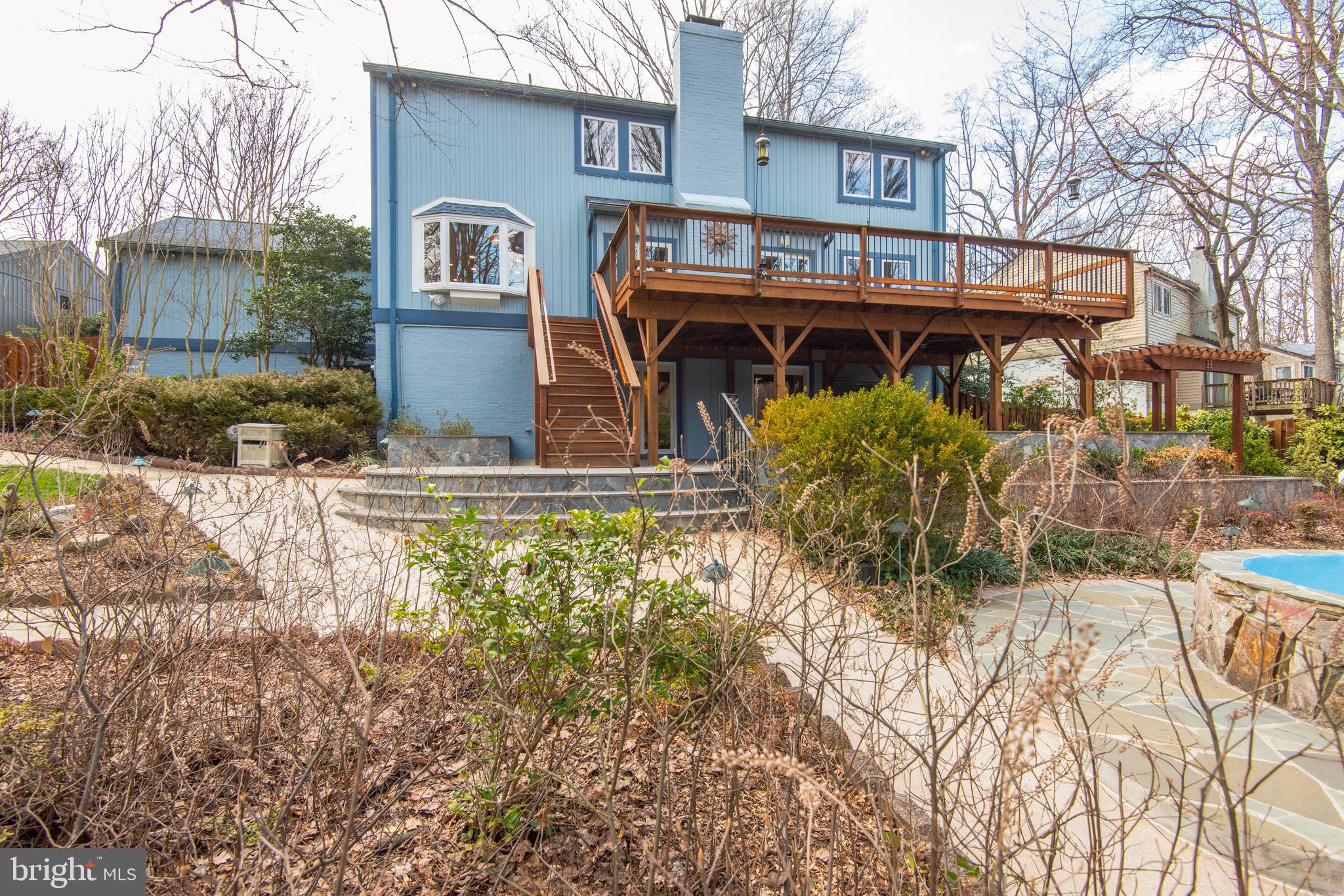 11805 Blue Spruce Road Reston, VA 20191 - Photo 71 of 74 a front view of a house with garden