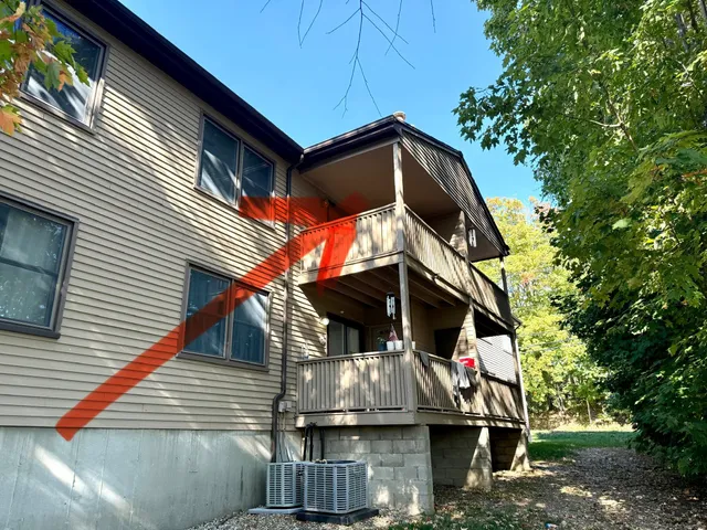 a view of house with a yard