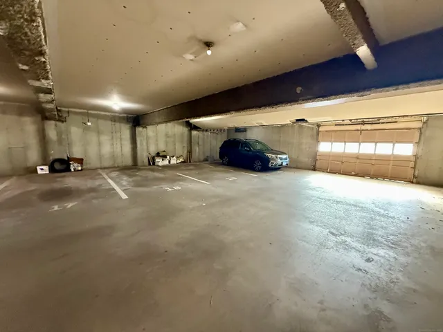 a view of an empty room with a fireplace