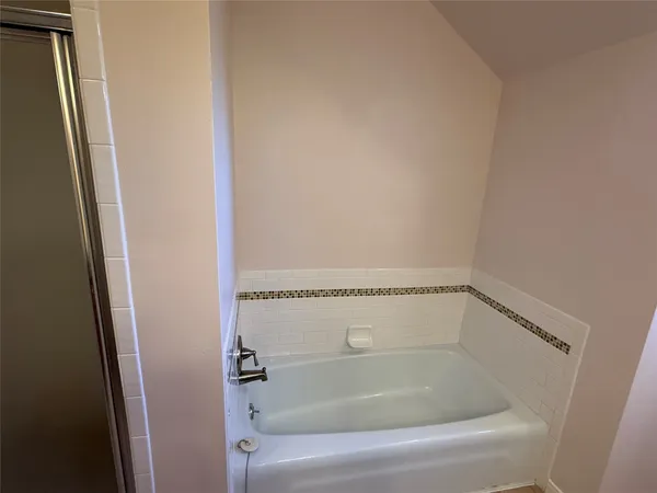 a close view of a bathtub in bathroom