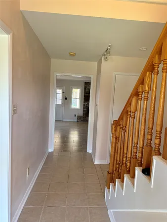 a view of a hallway view with staircase