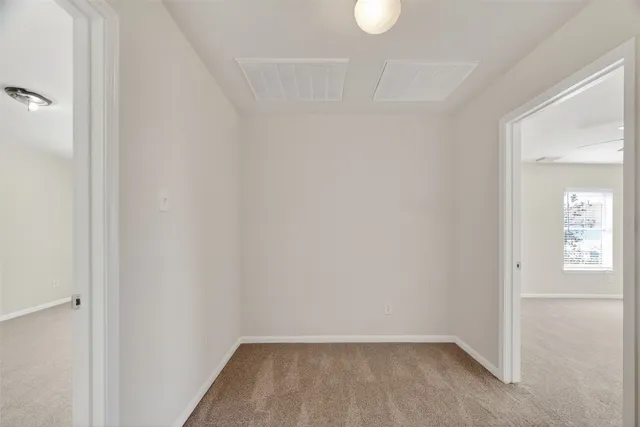 a kitchen with a refrigerator sink and cabinets