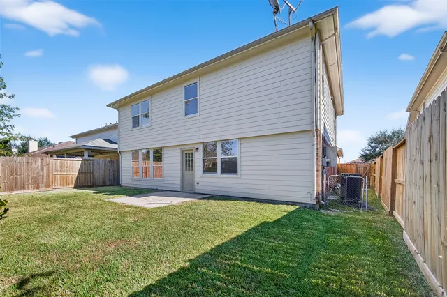 a house with a yard and a large tree