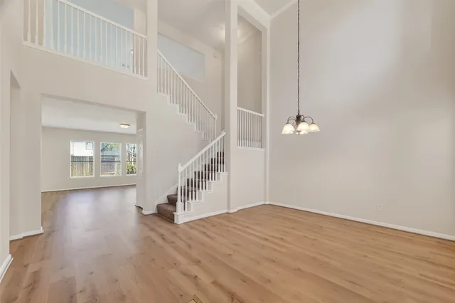 a view of an entryway with wooden floor