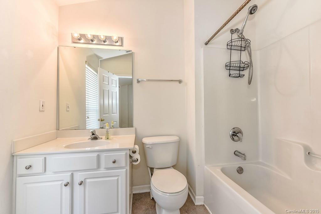 2144 Midnight Blue Lane, Unit 172 Fort Mill, SC 29708 - Photo 14 of 19 a bathroom with a sink a toilet and shower