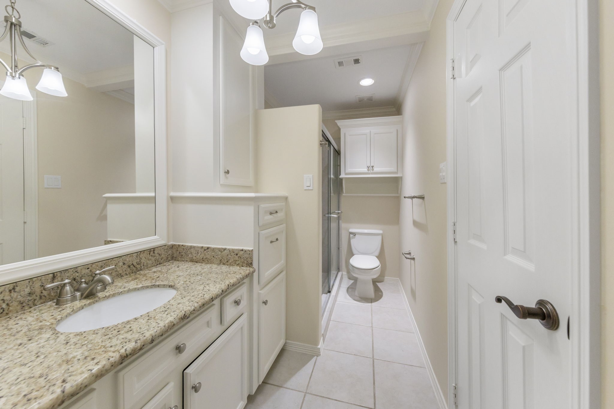 90 West Horizon Ridge Place Spring, TX 77381 - Photo 25 of 36 a bathroom with a granite countertop sink and a mirror