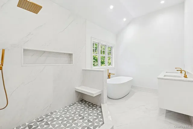 a bathroom with a toilet a sink and a bathtub