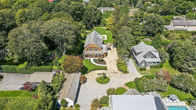 an aerial view of a house with outdoor space