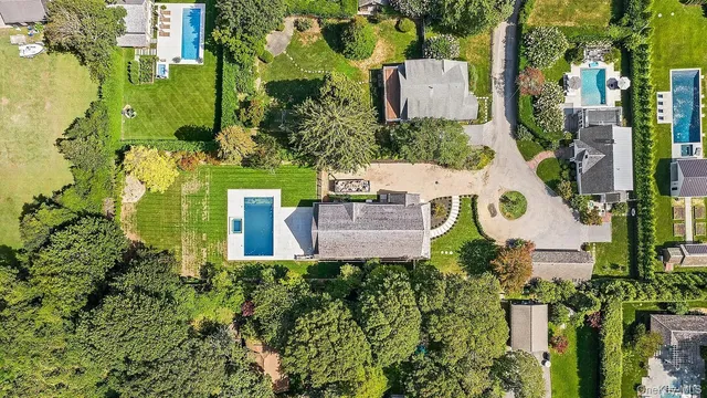 an aerial view of a house with a garden