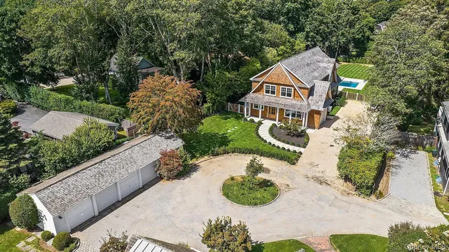a view of a street with potted plants