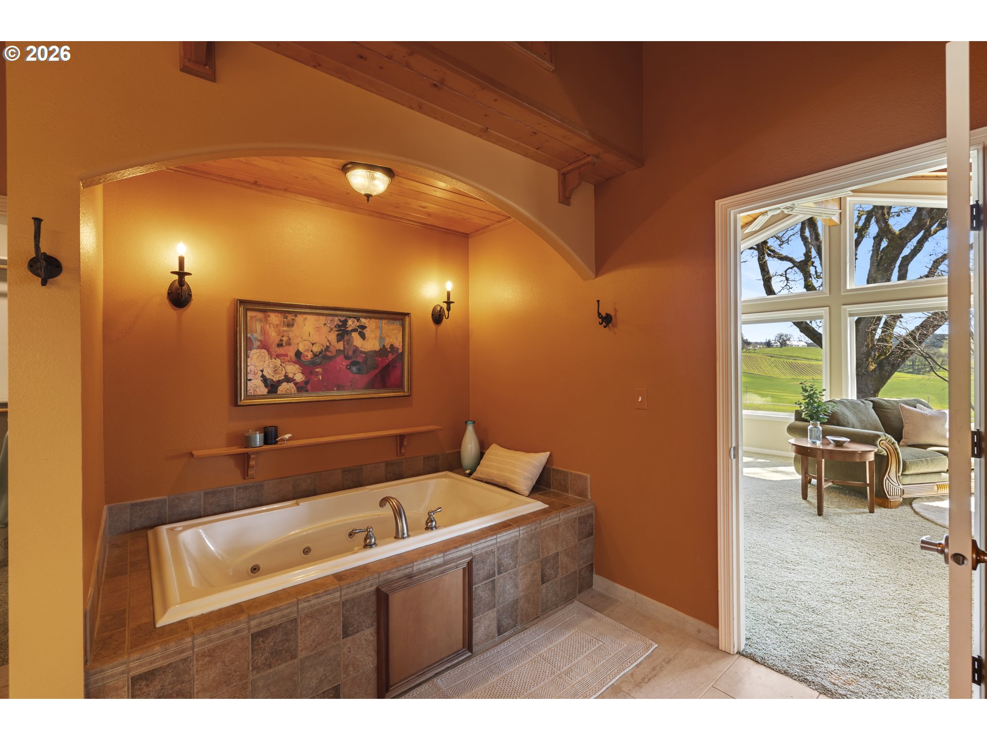 17795 Northeast Laughlin Road Yamhill, OR 97148 - Photo 16 of 48 a bathroom with a bathtub and a painting