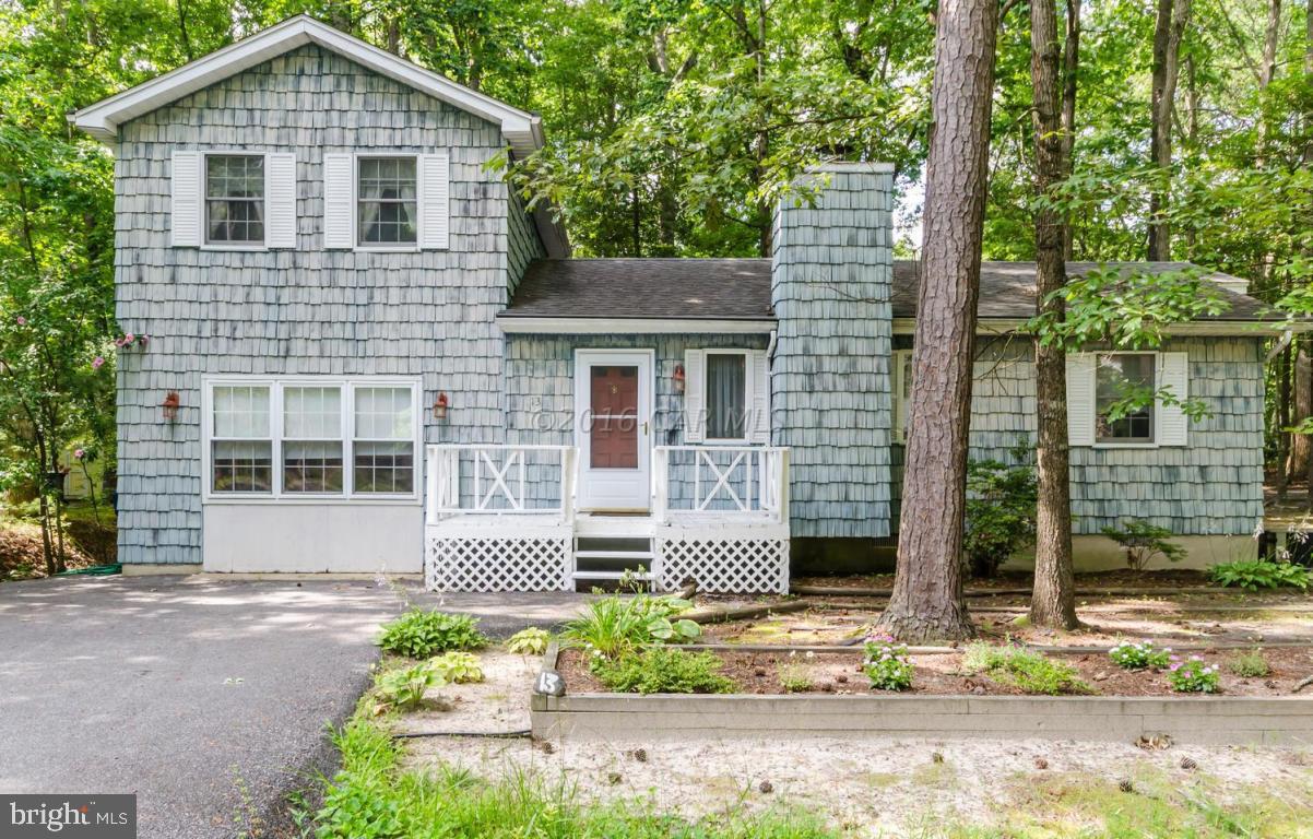 13 Capetown Road Ocean Pines, MD 21811 - Photo 2 of 46 a front view of a house with garden