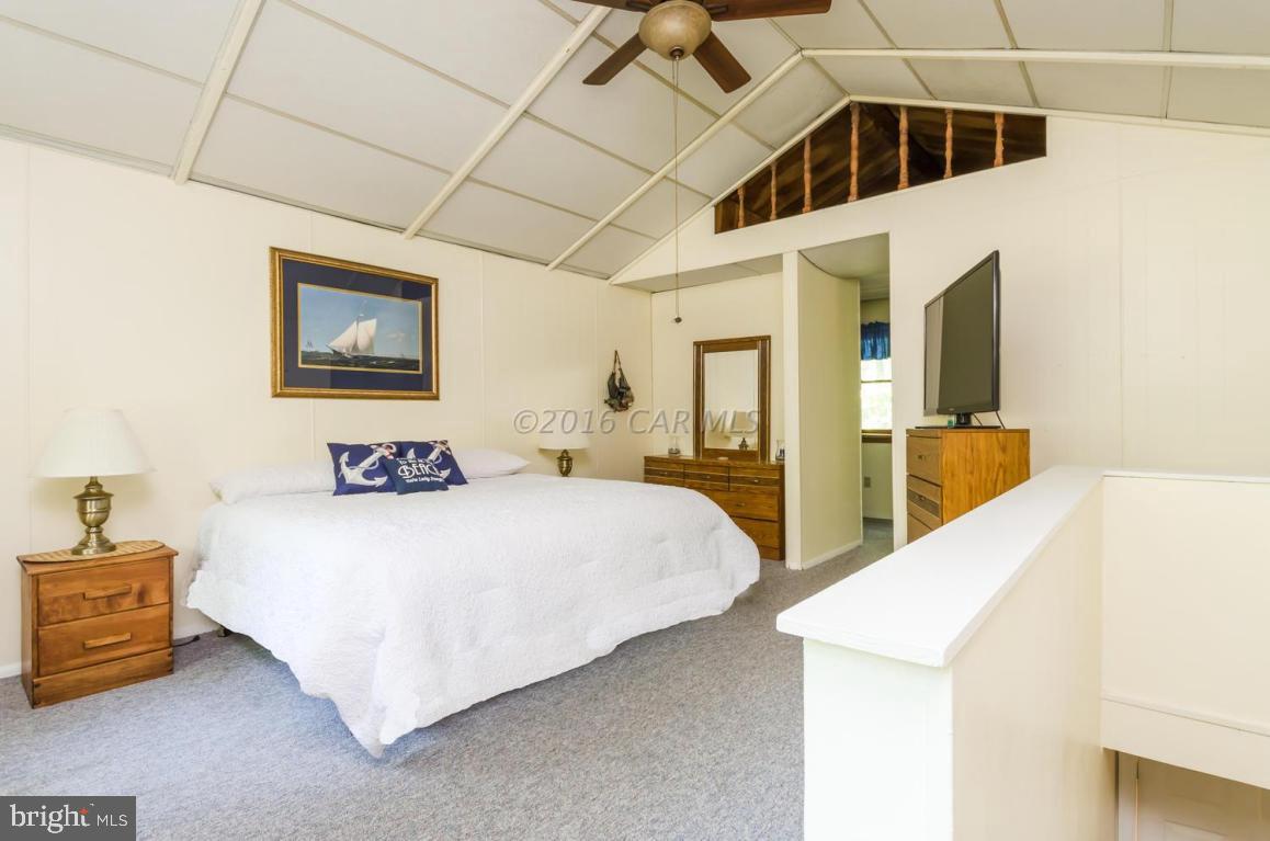13 Capetown Road Ocean Pines, MD 21811 - Photo 13 of 46 a bedroom with a bed and a large cabinets