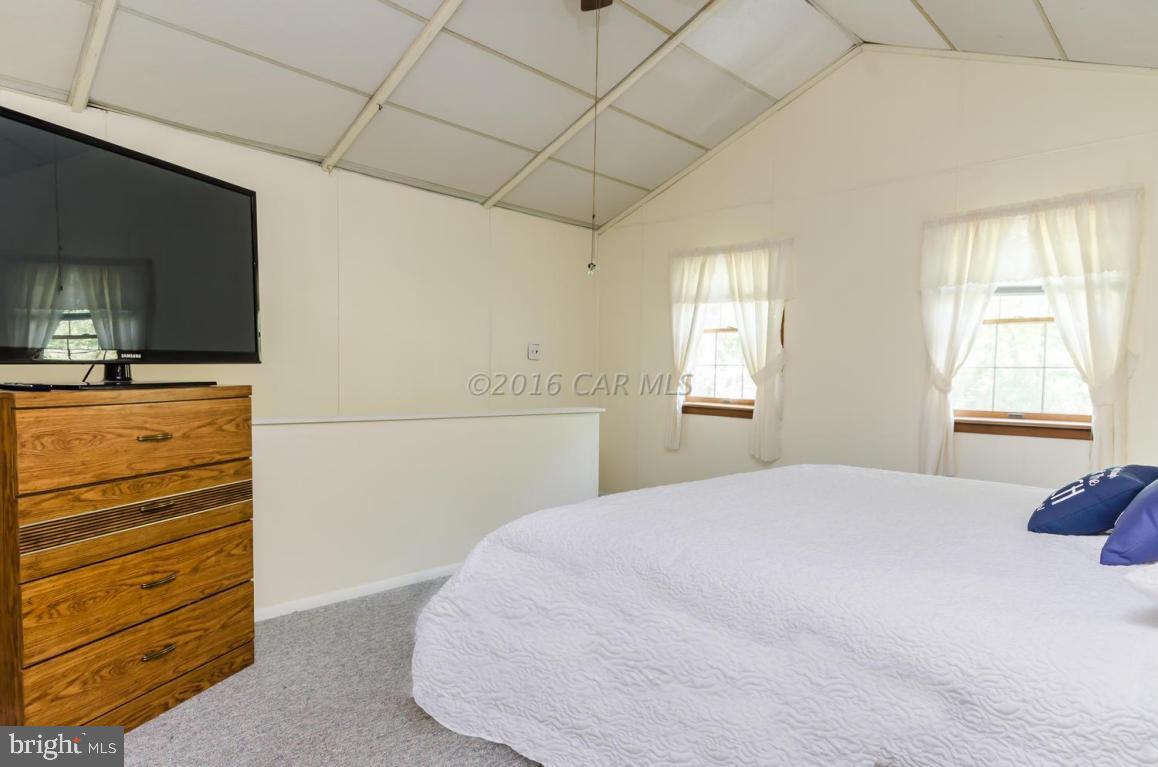13 Capetown Road Ocean Pines, MD 21811 - Photo 14 of 46 a bedroom with a bed and a dresser