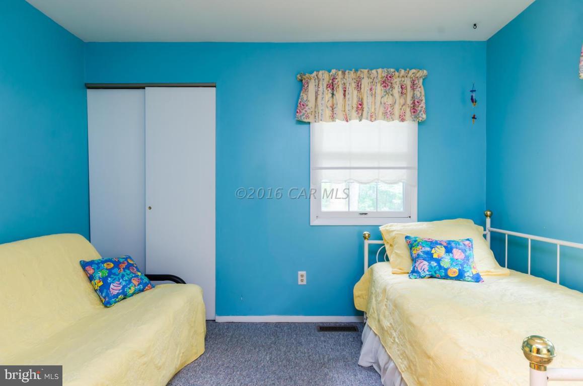 13 Capetown Road Ocean Pines, MD 21811 - Photo 16 of 46 a bedroom with a bed and window