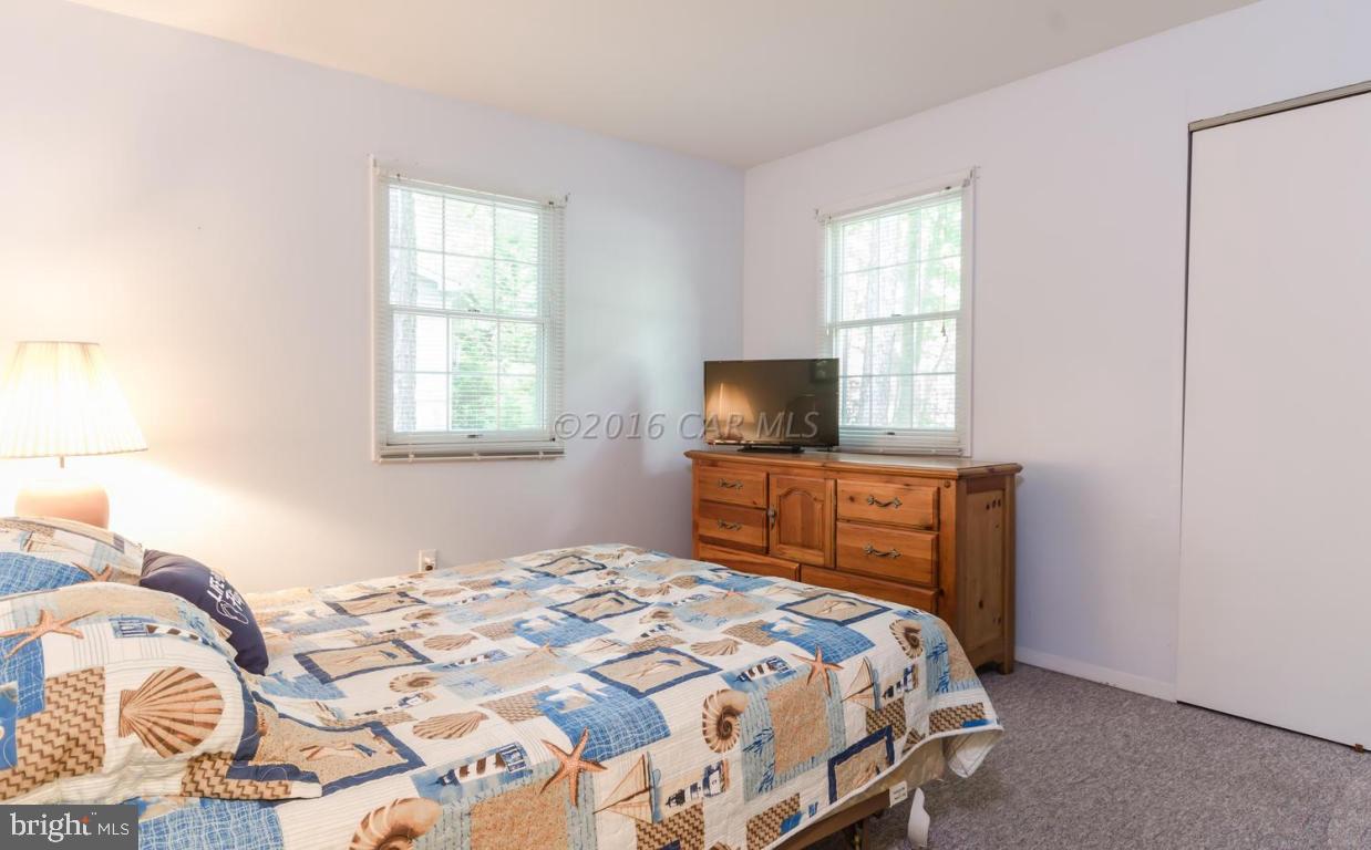 13 Capetown Road Ocean Pines, MD 21811 - Photo 17 of 46 a bedroom with a bed and a window