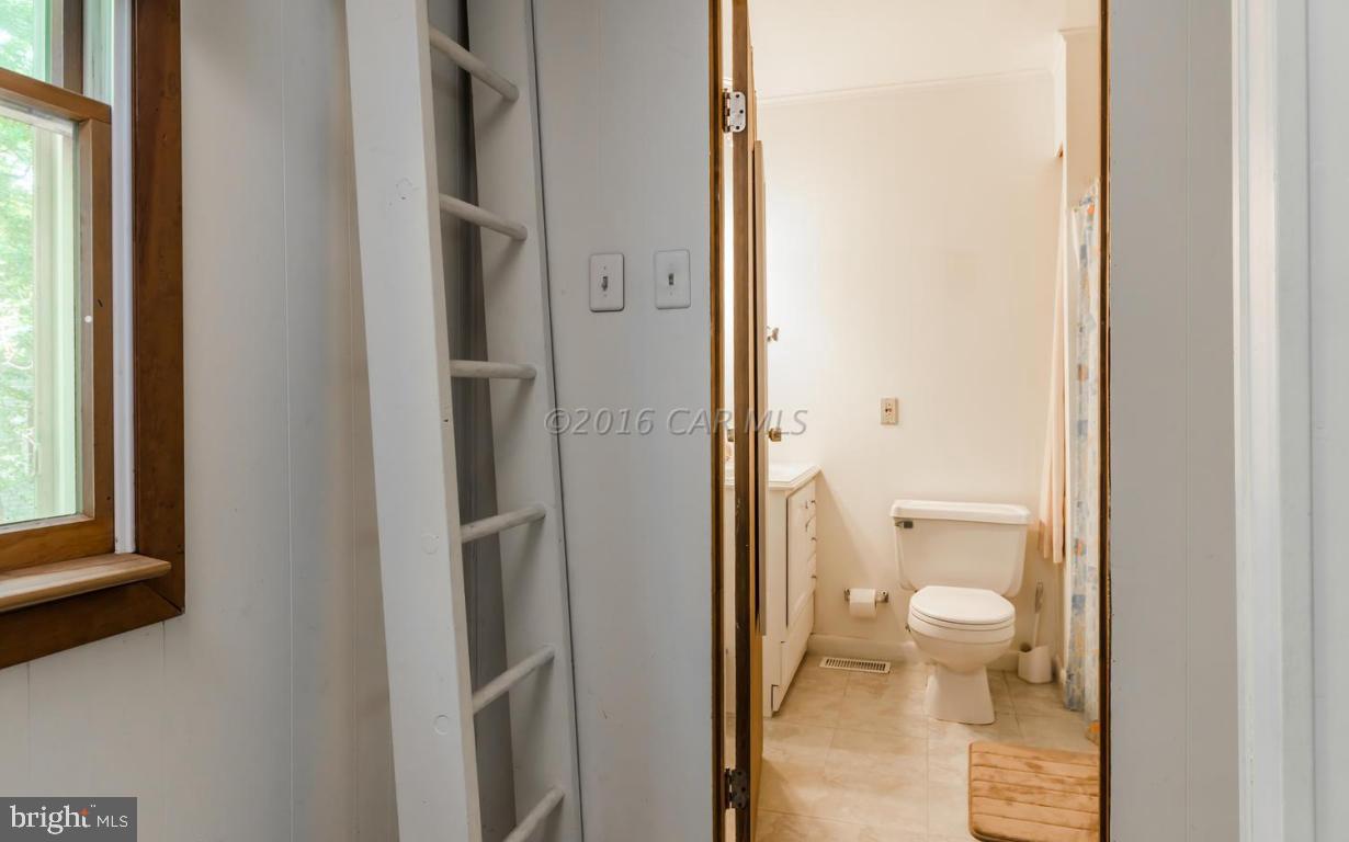 13 Capetown Road Ocean Pines, MD 21811 - Photo 18 of 46 a bathroom with a granite countertop toilet and a sink