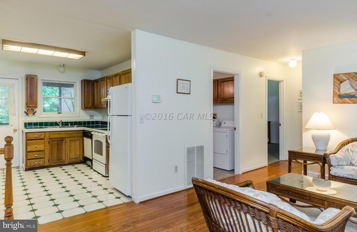 13 Capetown Road Ocean Pines, MD 21811 - Photo 19 of 46 a open kitchen with stainless steel appliances kitchen island granite countertop a refrigerator and a stove top oven