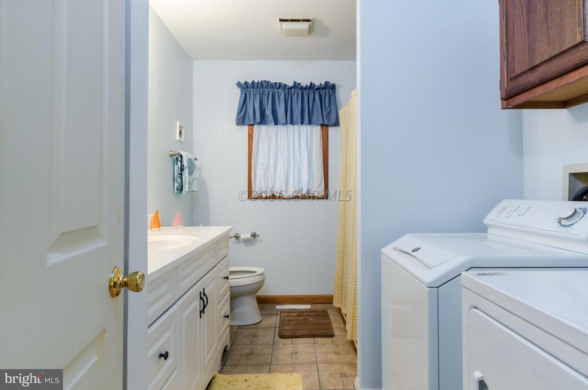 13 Capetown Road Ocean Pines, MD 21811 - Photo 20 of 46 a bathroom with a sink toilet and shower