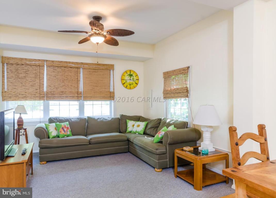13 Capetown Road Ocean Pines, MD 21811 - Photo 21 of 46 a living room with furniture and a large window