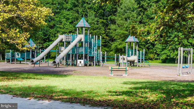 13 Capetown Road Ocean Pines, MD 21811 - Photo 31 of 46 a view of a park with swings and slides