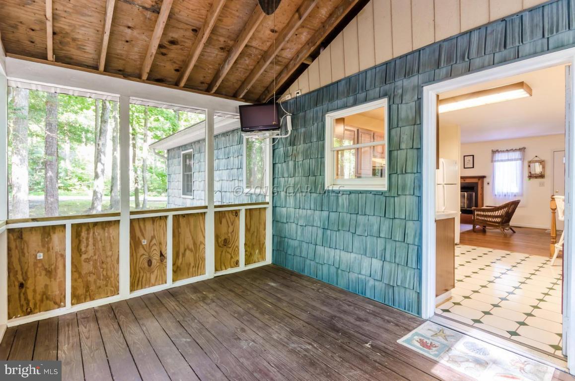 13 Capetown Road Ocean Pines, MD 21811 - Photo 9 of 46 a view of porch with wooden floor and furniture