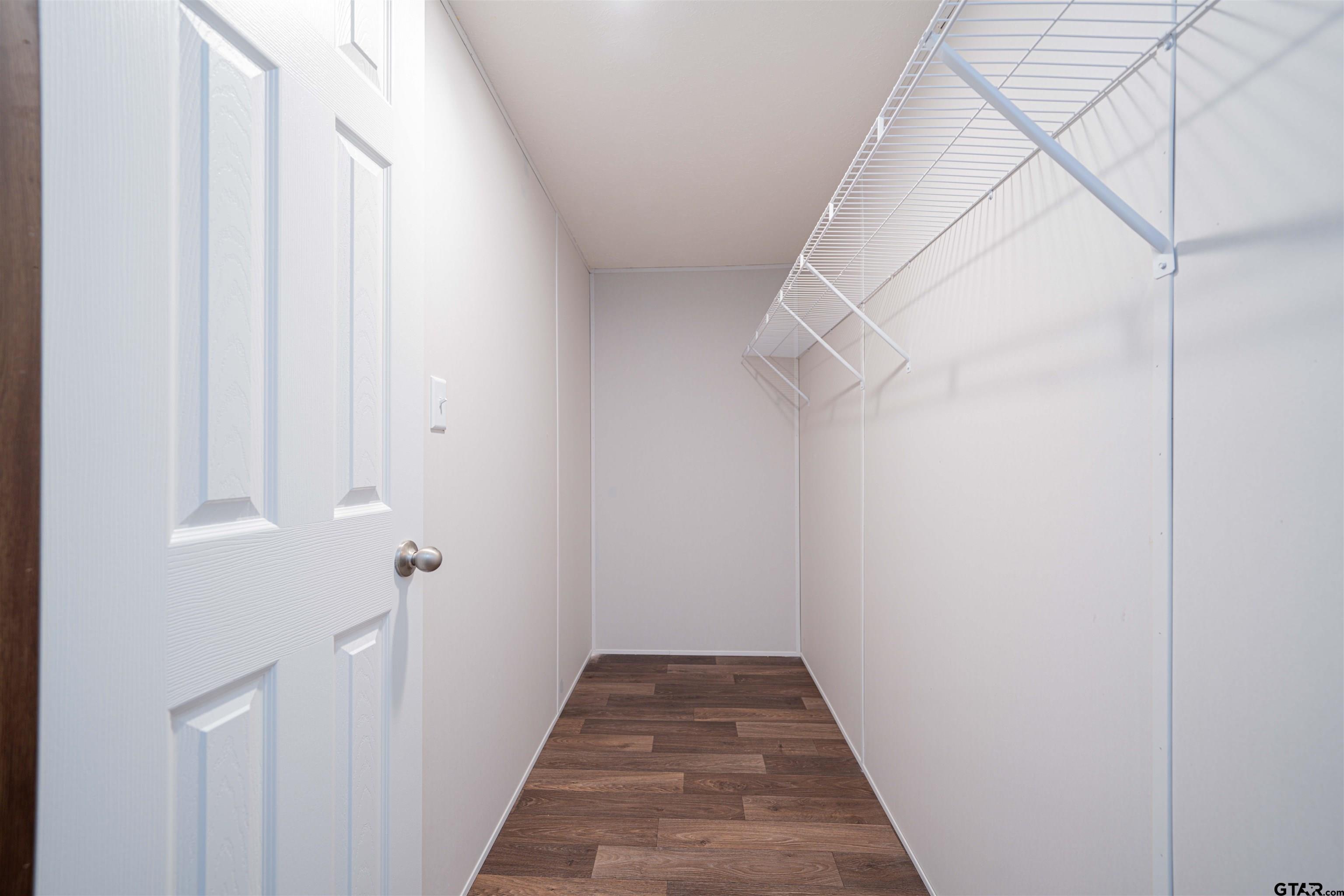 Mh1 Mh1 Mh1 Leesburg, TX 75451 - Photo 22 of 23 a view of a hallway with a white walls and a white door