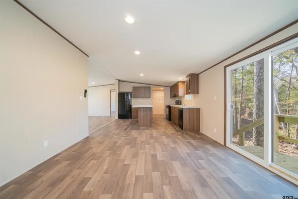 a view of a kitchen with wooden floor