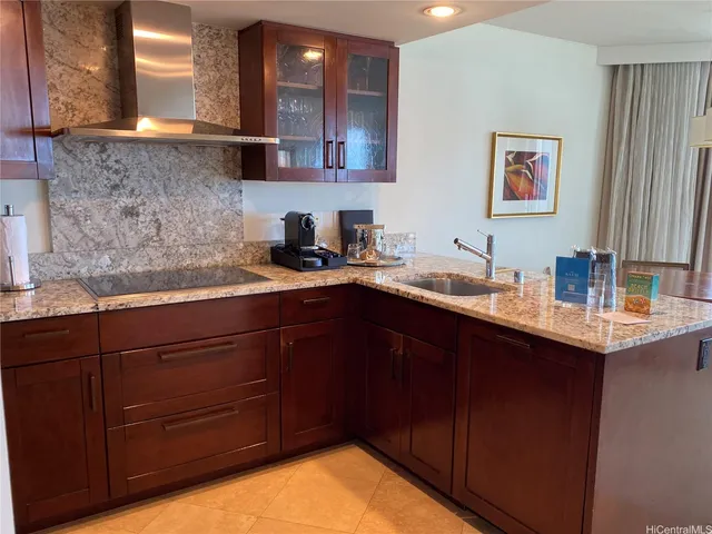a kitchen with a sink and cabinets