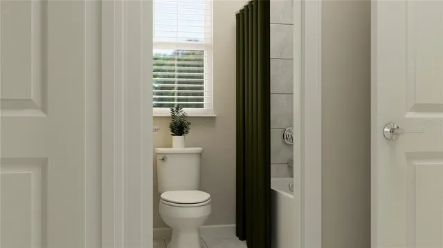 a bathroom with a toilet and a sink