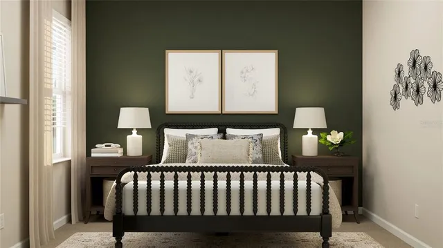 a bed sitting in a bedroom next to a window