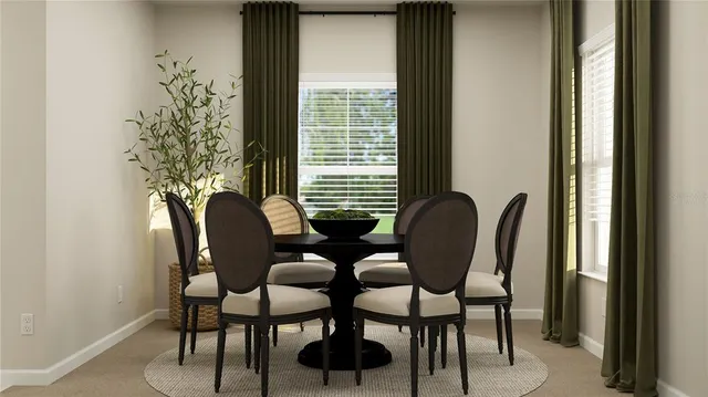 a view of a dining room with furniture and window