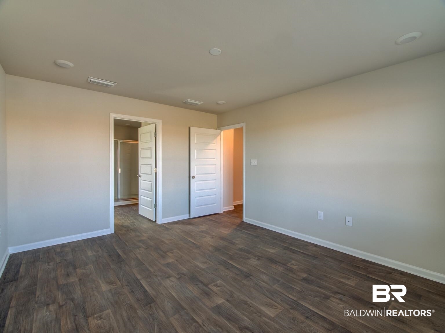 23952 Citation Loop Daphne, AL 36526 - Photo 23 of 69 Unfurnished bedroom with dark wood finished floors and baseboards