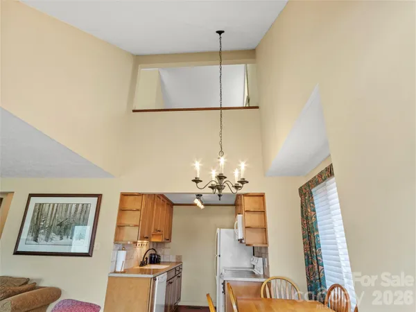 a kitchen with a refrigerator a stove top oven a sink and dishwasher