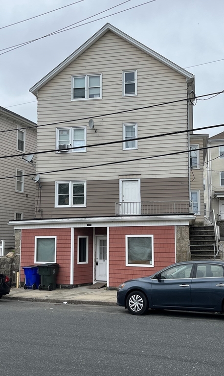 422 County Street Fall River, MA 02723 - Photo 1 of 25 a front view of a house with a parking space