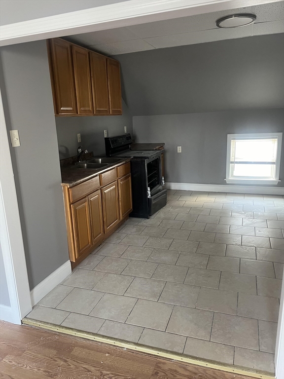 422 County Street Fall River, MA 02723 - Photo 16 of 25 a kitchen with stainless steel appliances granite countertop a sink stove and cabinets