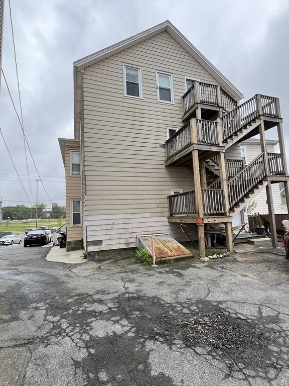 422 County Street Fall River, MA 02723 - Photo 5 of 25 a view of a house with a yard