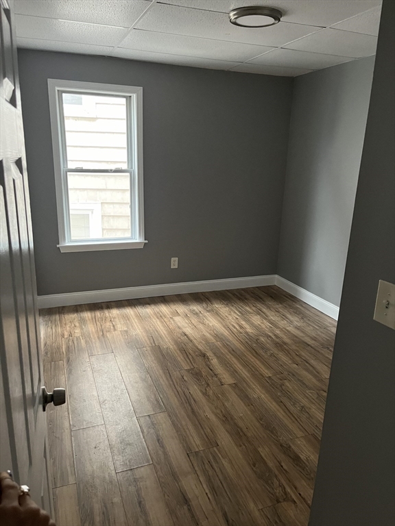 422 County Street Fall River, MA 02723 - Photo 8 of 25 an empty room with wooden floor and windows