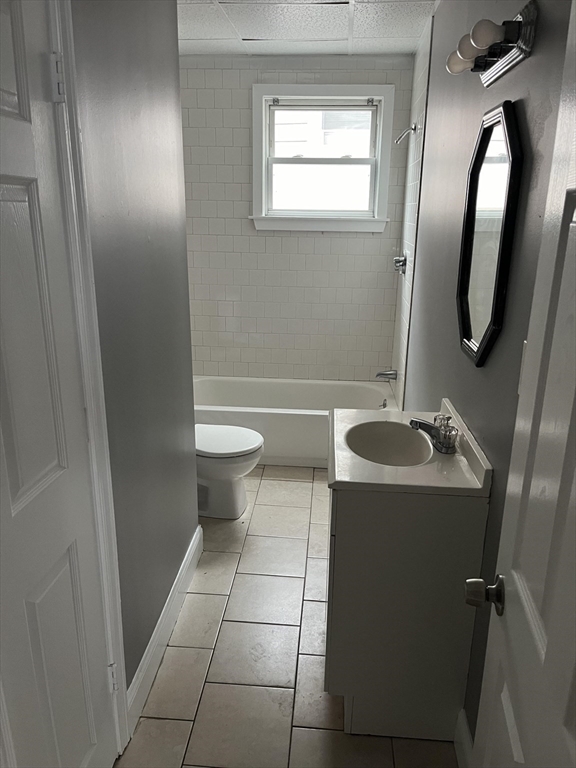 422 County Street Fall River, MA 02723 - Photo 10 of 25 a bathroom with a sink a toilet and mirror