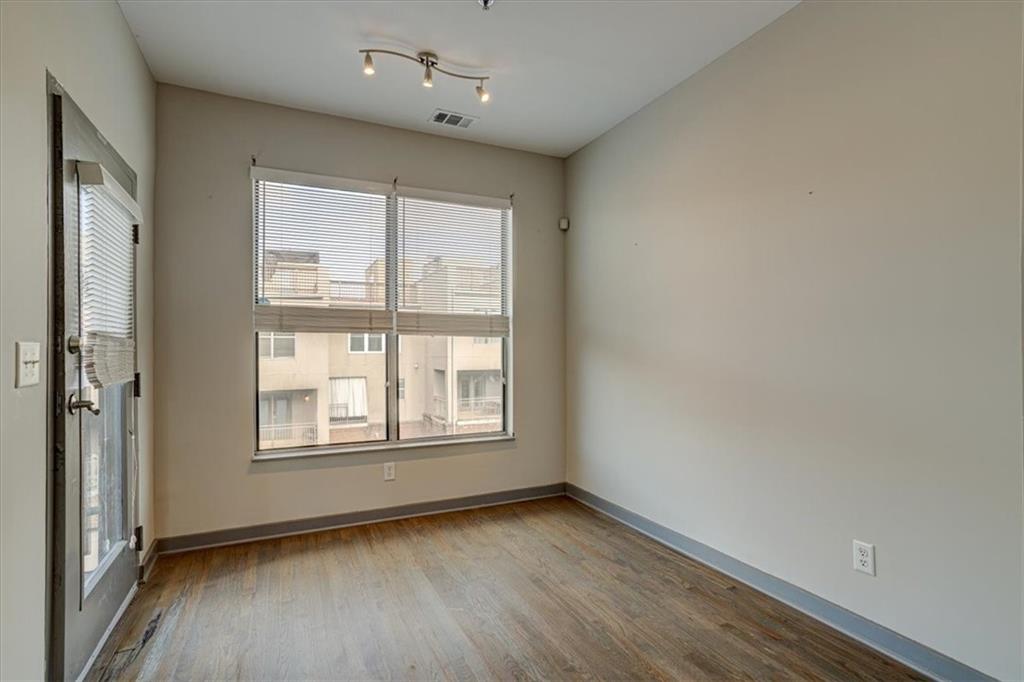 238 Walker Street Southwest, Unit 32 Atlanta, GA 30313 - Photo 15 of 17 an empty room with wooden floor and windows