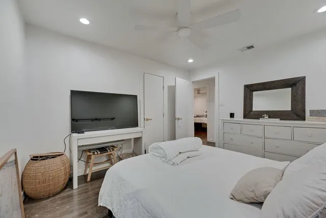 a bedroom with a bed and a television in it