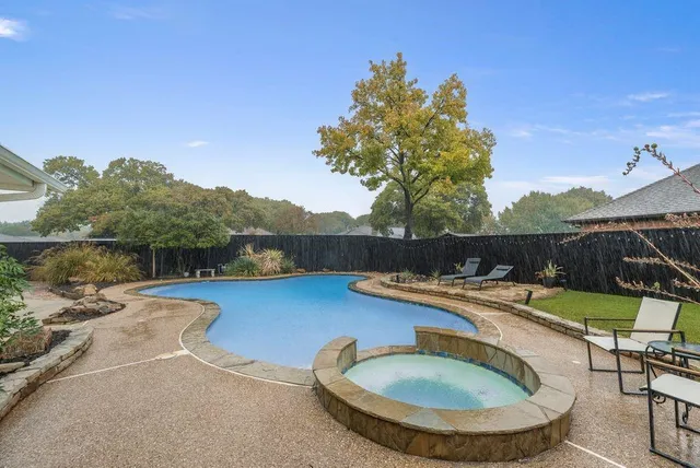 a view of a swimming pool with a patio