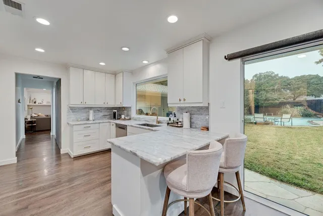 a kitchen with a table and chairs in it