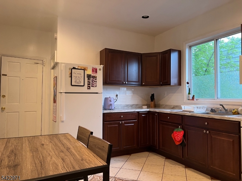 5 Timothy Street, Unit 4 Paterson, NJ 07503 - Photo 11 of 16 a kitchen with a sink cabinets and window