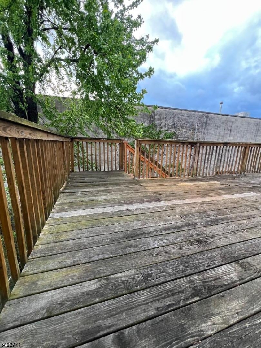 5 Timothy Street, Unit 4 Paterson, NJ 07503 - Photo 14 of 16 a view of deck and mountain view from a balcony