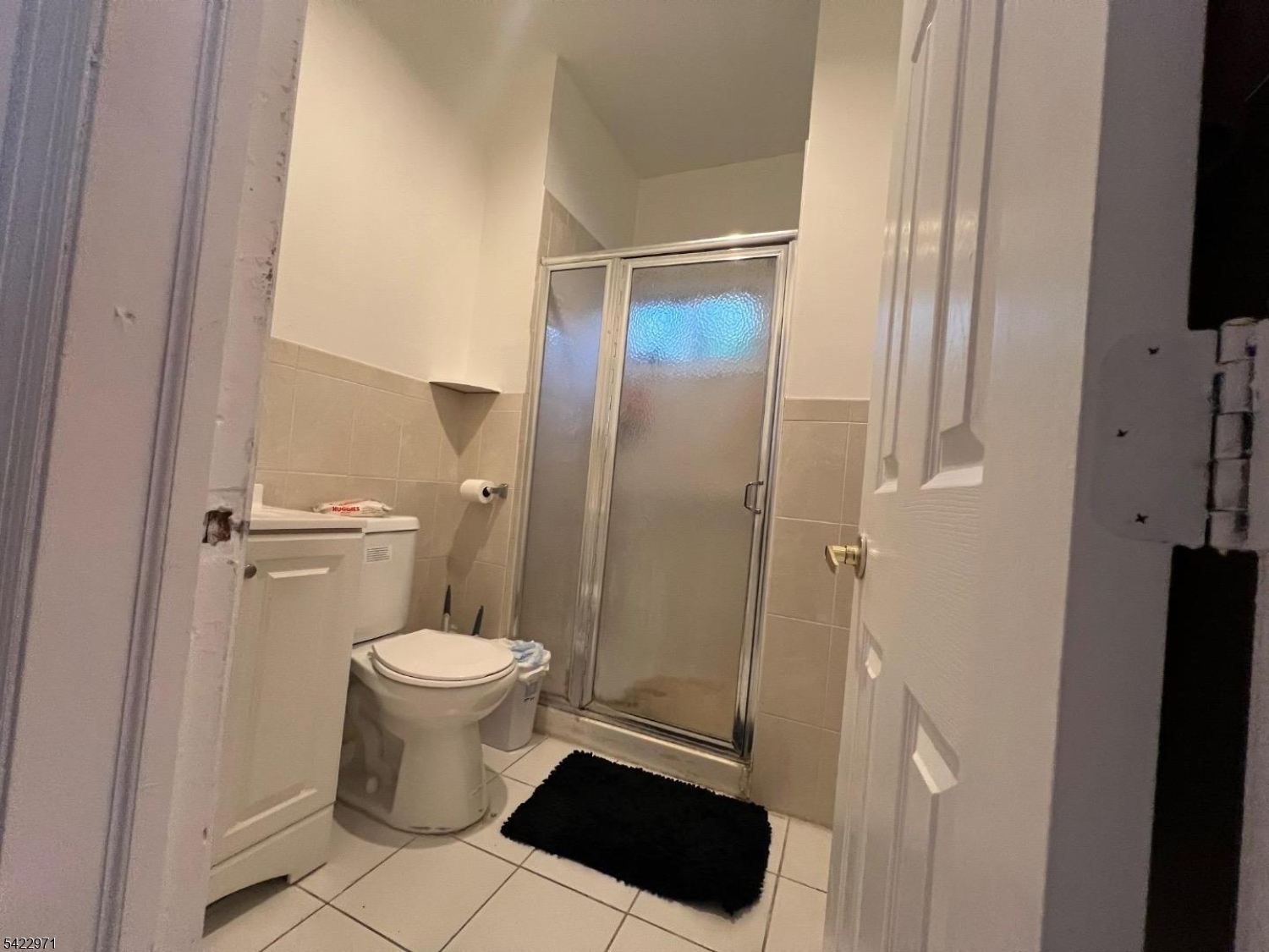 5 Timothy Street, Unit 4 Paterson, NJ 07503 - Photo 15 of 16 a white toilet sitting next to a bathroom sink