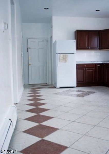 5 Timothy Street, Unit 4 Paterson, NJ 07503 - Photo 2 of 16 a view of a kitchen with a sink and a microwave